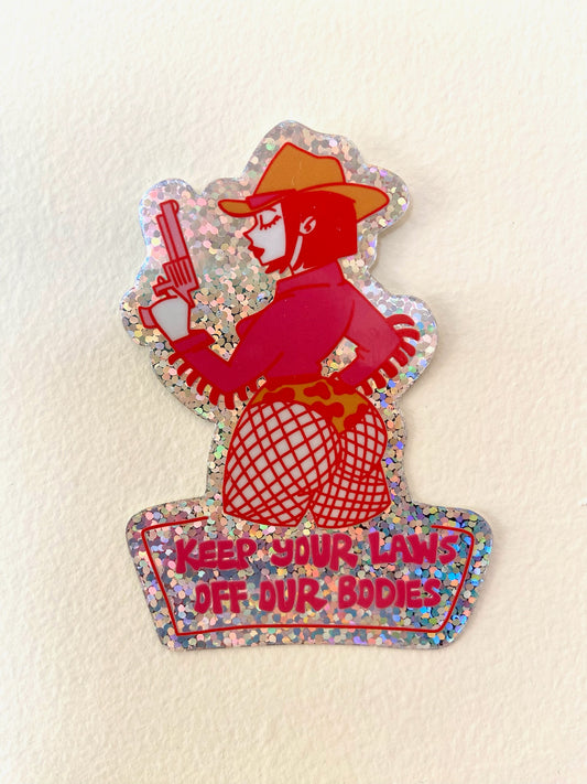 "Keep your laws off our bodies" glitter sticker